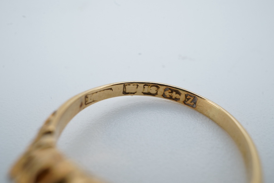 A late Victorian 18ct gold and oval white opal ring with six stone diamond set shoulders, size J, hallmarked for Birmingham, 1899, gross weight 2.5 grams. Condition - poor to fair